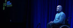A picture of Mark on stage, delivering his talk