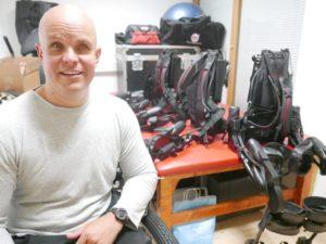 the red table and the three Ekso Bionics exoskeletons