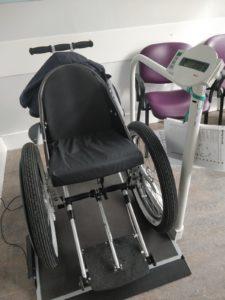 Photo of Mark's wheelchair being weighed on weighbridge